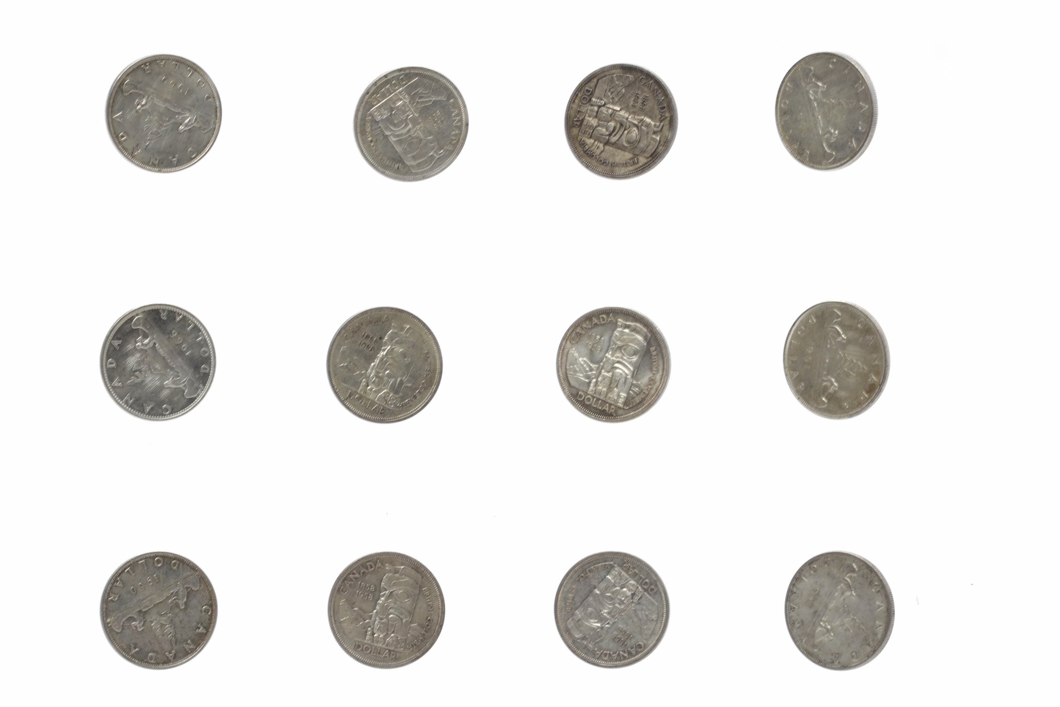 TWENTY FOUR CANADA SILVER DOLLARS comprising twelve commemorative examples dated 1867-1967,