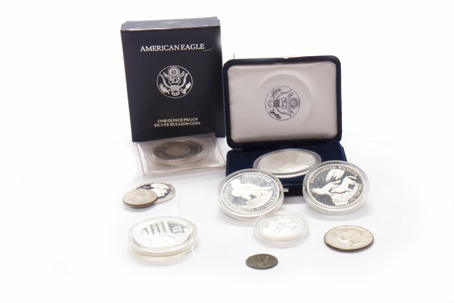 AMERICAN EAGLE 1OZ SILVER PROOF COIN along with five other coins in capsules,