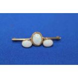 OPAL BAR BROOCH AND EARRINGS the brooch set with a single oval cabochon opal,