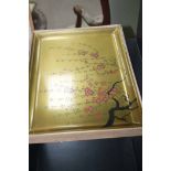 1920S JAPANESE LAQUERED TRAY in gold, painted with a floral design,