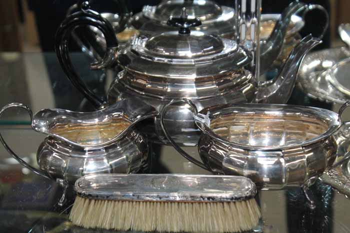 STERLING SILVER VANITY SET comprising of a mirror and two brushes,