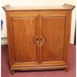 EARLY/MID 20TH CENTURY CHINESE ROSEWOOD CABINET the double doors opening to reveal sliding shelves,