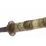 EARLY 20TH CENTURY JAPANESE BONE SWORD carved with figures in landscape, with brass mounts,