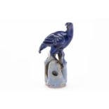 EARLY 20TH CENTURY CHINESE TURQUOISE GLAZED PIGEON the bird modelled nestled on a rock, 22.