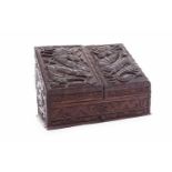 EARLY 20TH CENTURY CHINESE CARVED WOOD STATIONERY BOX carved with dragons in relief,