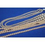 PASTE PEARL NECKLACE with a simulated damond clasp and three others (4)