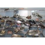 LARGE COLLECTION OF TOURIST SPOONS including silver examples, silver plated examples,