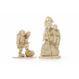 TWO EARLY 20TH CENTURY JAPANESE IVORY CARVED GROUPS one modelled as a man with child and fish, 11.