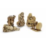 FIVE EARLY 20TH CENTURY JAPANESE IVORY NETSUKE three figural examples and two animal examples,