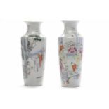 PAIR OF EARLY 20TH CENTURY CHINESE BALUSTER VASES decorated with figural scenes, 26cm high,