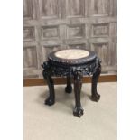 EARLY 20TH CENTURY CHINESE HARDWOOD JARDINIERE STAND with marble inset top,