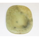 A CHINESE CARVED JADE INK STONE, 20th century, 3in (8cm).