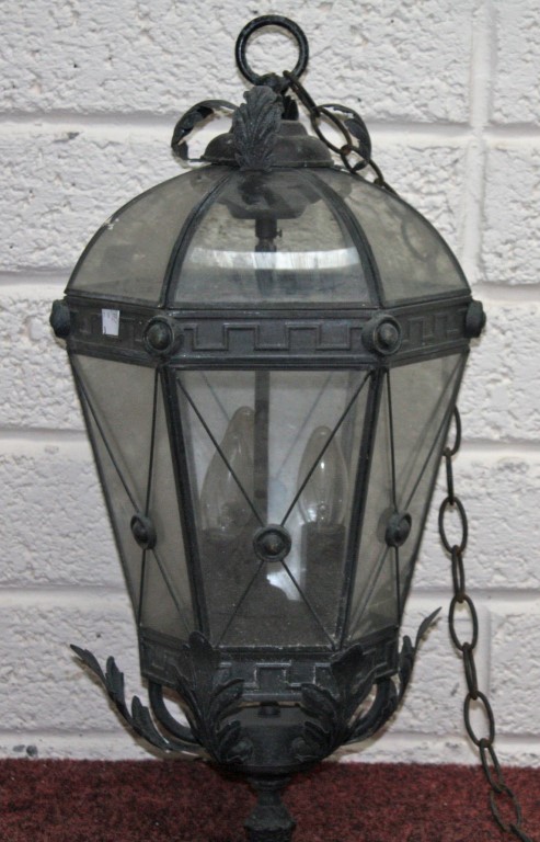 A BRONZED METAL HALL LANTERN, of hexagonal tapering form, with twelve glass panels and domed top,