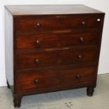 A GEORGE IV PERIOD MAHOGANY CHEST, 
with four long graduating drawers and raised on turned legs,