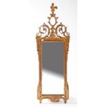 AN ATTRACTIVE LATE 19TH CENTURY GILT PIER MIRROR, 
with leaf crest and a central oval panel,