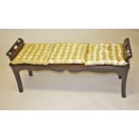 A MAHOGANY HALL OR WINDOW STOOL, with triple cushion solid seat and cut out arm rests,