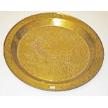 A LARGE CIRCULAR EASTERN BRASS DISH, 
or table top,