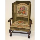 AN IRISH MAHOGANY WING ARMCHAIR, in George II style, late 19th century, with tapestry back,