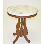 AN OVAL WALNUT OCCASIONAL TABLE, 
late 19th century, with white marble top,