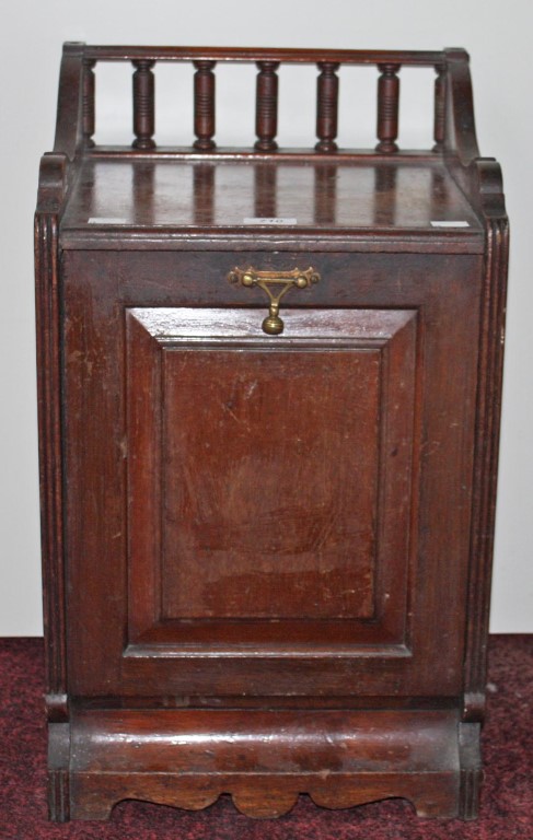 AN EDWARDIAN WALNUT COAL SCUTTLE, 
with gallery back and paneled door, 13.