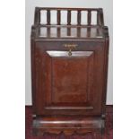 AN EDWARDIAN WALNUT COAL SCUTTLE, 
with gallery back and paneled door, 13.