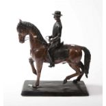 A BRONZE EQUESTRIAN GROUP, modelled with dressage horse and jockey, 23in(59cm)h x 22in(56cm)l.