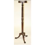 A MAHOGANY TORCHÈRE,