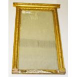 A 19TH CENTURY GILT PIER MIRROR, 
with bead and gadroon moulded frame, 31in (79cm)h x 20in (51cm).