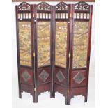 A FOUR FOLD JAPANESE WOODEN SCREEN, 
the printed panels depicting figures, dwellings, landscapes,