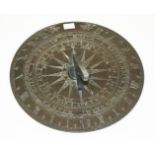 A CIRCULAR BRONZE SUNDIAL, 
19th century, with shaped gnomon, the dial with months of the year,