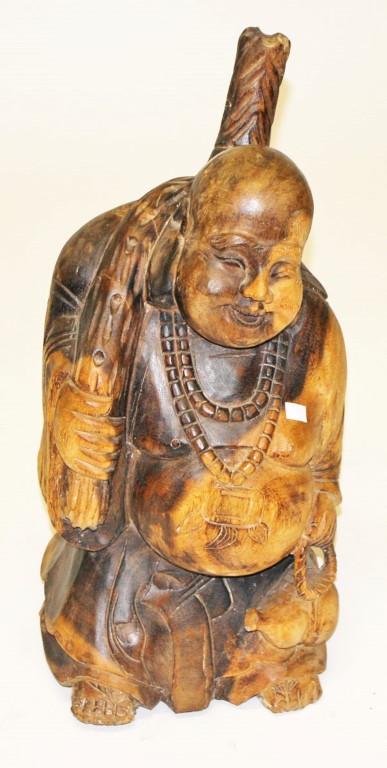 A CARVED CHINESE WOODEN FIGURE OF A STANDING  BUDDHA, 
wearing a bead necklace, 26in (66cm).