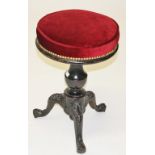 AN UNUSUAL VICTORIAN PIANO STOOL, 
with circular padded seat, on a baluster turned stem,
