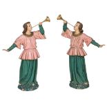 A PAIR OF EARLY CARVED WOODEN POLYCHROME DECORATED FIGURES, 
of religious trumpeters,
