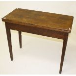 A FOLDOVER MAHOGANY TEA TABLE, 
19th century with rectangular top with square tapering legs, 33.