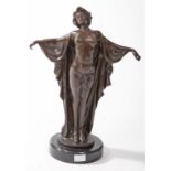 A BRONZE FIGURE OF A SEMI NUDE DANCER, 
on circular polished limestone base, 14in (36cm).