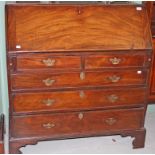 A GEORGE III PERIOD MAHOGANY SLOPE FRONT BUREAU,