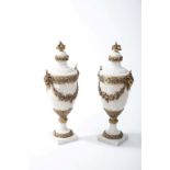 A PAIR OF WHITE VEINED MARBLE MANTELPIECE URNS, 
each in the Matthew Bolton style,