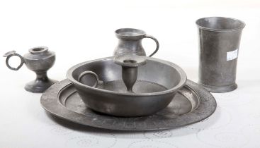 A COLLECTION OF PEWTER BOWLS AND BASINS, and a pewter steamer, a chamber candlestick,