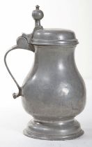 AN EARLY ENGLISH BALUSTER SHAPED PEWTER TAPPIT HEN, with domed and hinged cover,