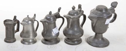 A PAIR OF SMALL PEWTER LIDDED JUGS, one with a thumb piece in the form of the letter A,