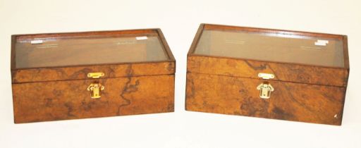 A PAIR OF ATTRACTIVE WALNUT DISPLAY BOXES, O.R.M., each with a hinged and glazed top, 14.