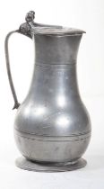 AN EARLY PEWTER POT BELLY TAPPIT HEN, with hinged cover and double acorn thumb piece,