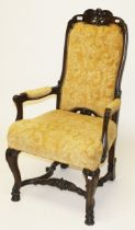 A HIGH BACK CONTINENTAL WALNUT ARMCHAIR, in the 18th century style,