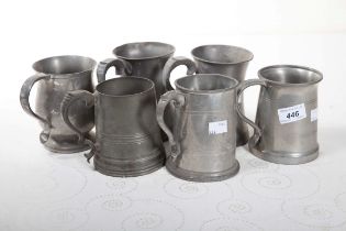 SIX PEWTER PINT MEASURES, various sizes and shapes.