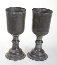 AN ALMOST MATCHING PAIR OF EARLY PEWTER CHALICES, probably Irish, each with a bucket shaped bowl,