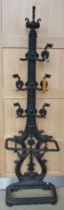 A HEAVY VICTORIAN CAST IRON HALL STAND, the hooks in the form of stylized griffin's (one missing),