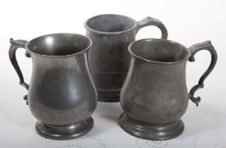 TWO BALUSTER SHAPED PINT TANKARDS, another pint tankard, indistinctly inscribed with a name,