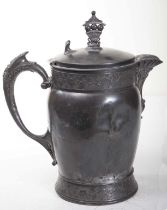 A HEAVY AND UNUSUAL LARGE PEWTER JUG, with cavity centre, probably hot water,