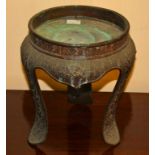 AN EARLY CHNESE BRONZE TABLE STAND, or jardiniere stand,