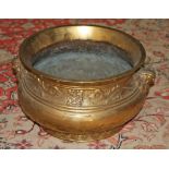 A HEAVY CHINESE GILT BRONZE BOWL, with pot belly and two grotesque mythical animal mask handles,